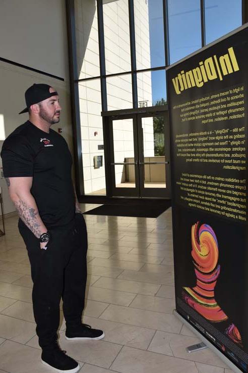 A student browsing the gallery at the event.